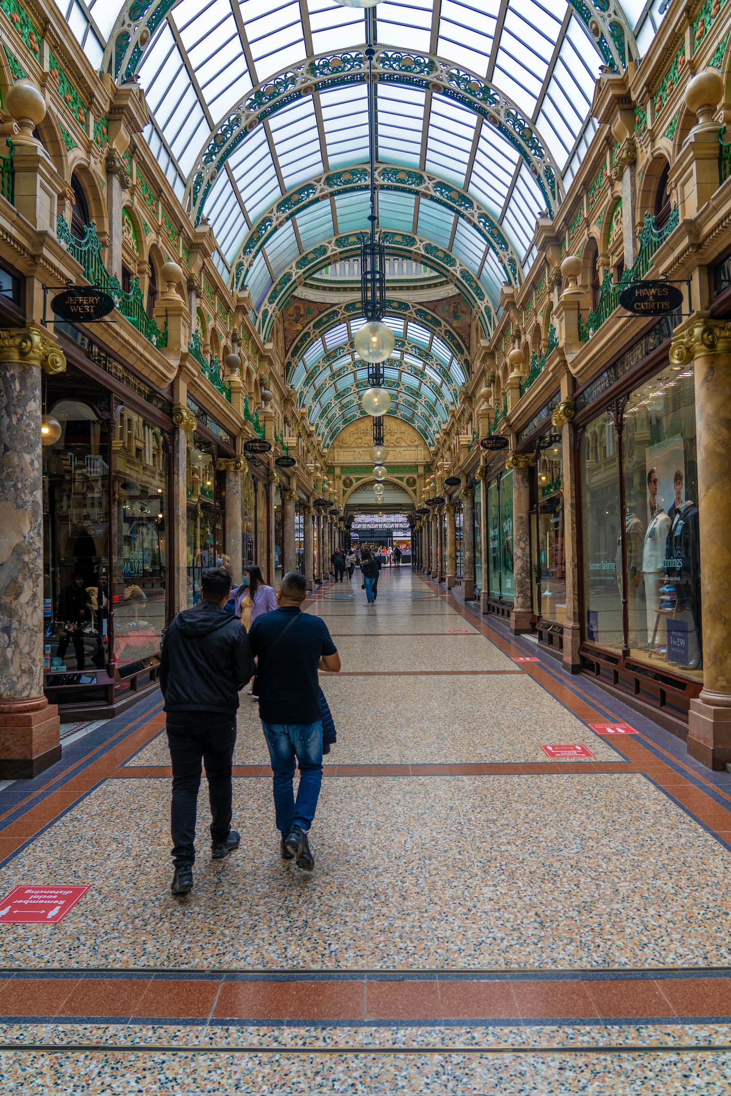 a person walking through arcade