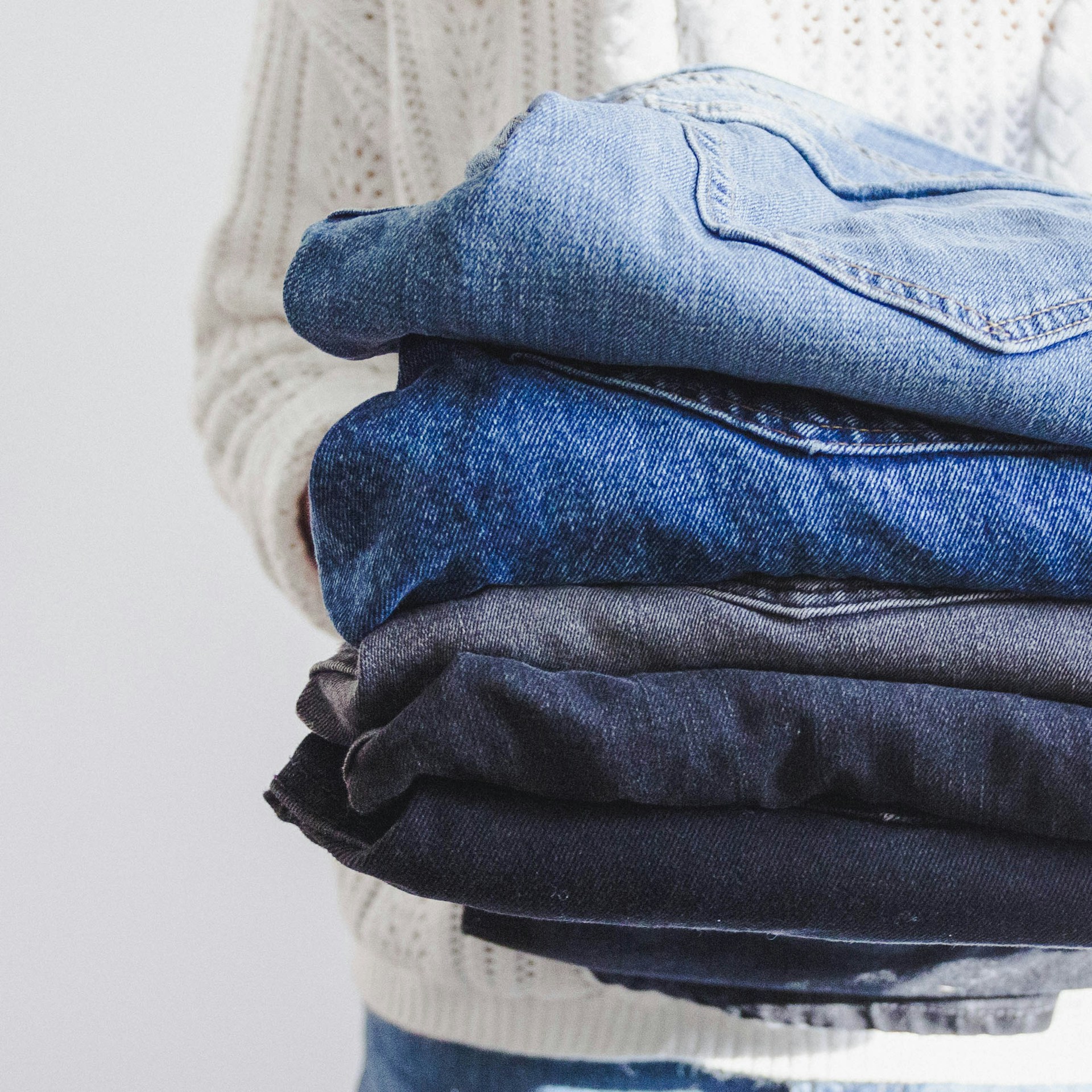A person holding a pile of