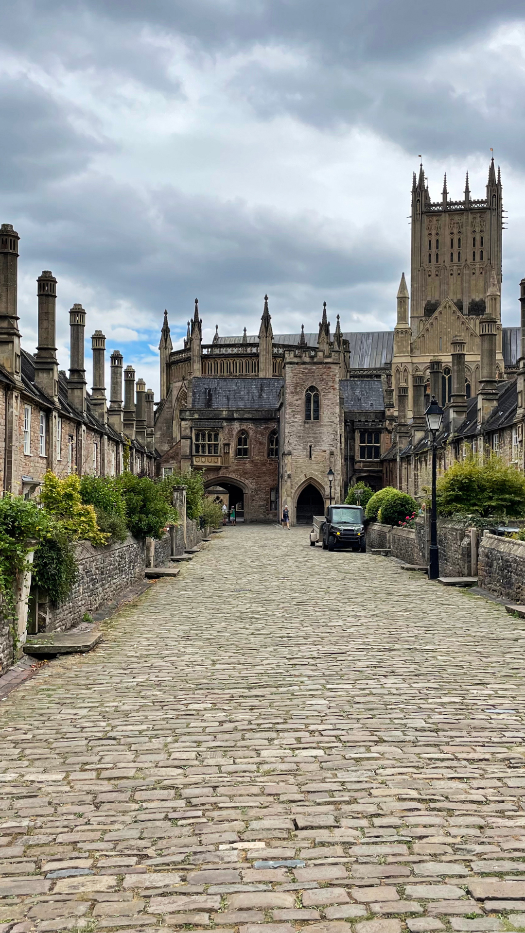 a stone castle next to a brick building