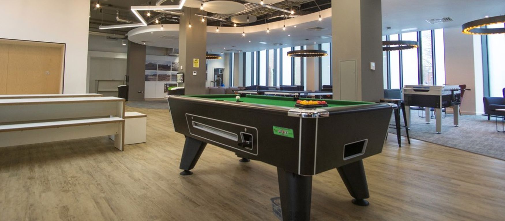 a social space with a pool table