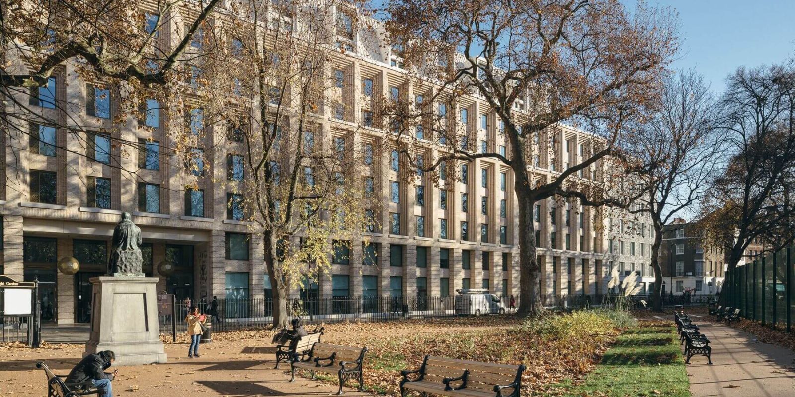 a park bench in front of a building
