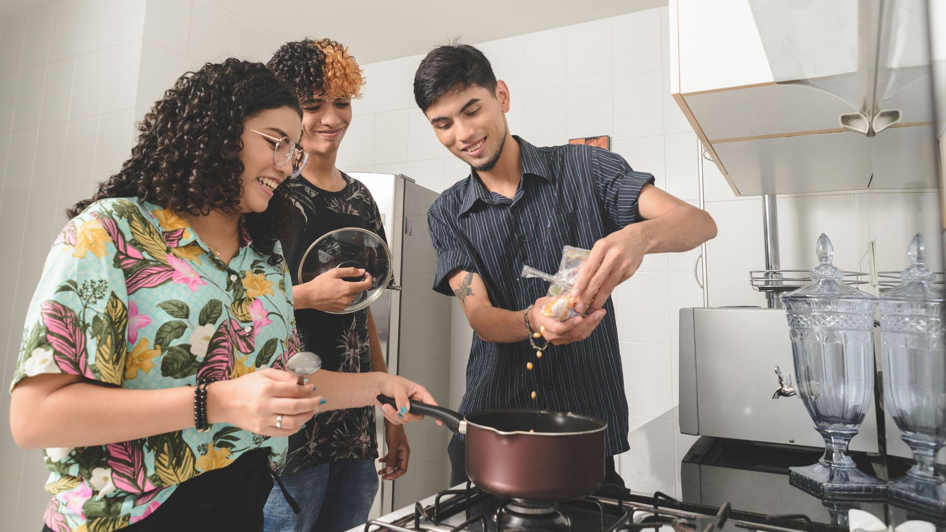a man and woman cooking food in a kitchen