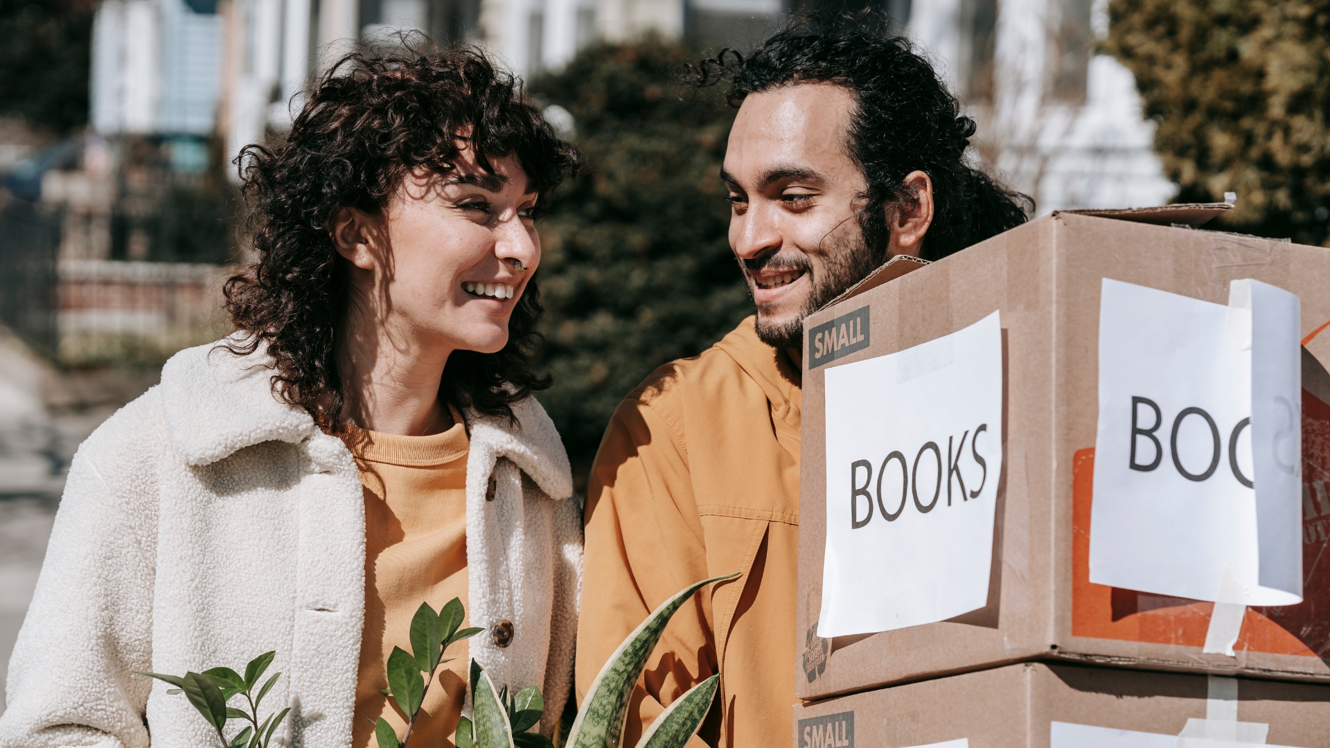 a man and a woman moving out
