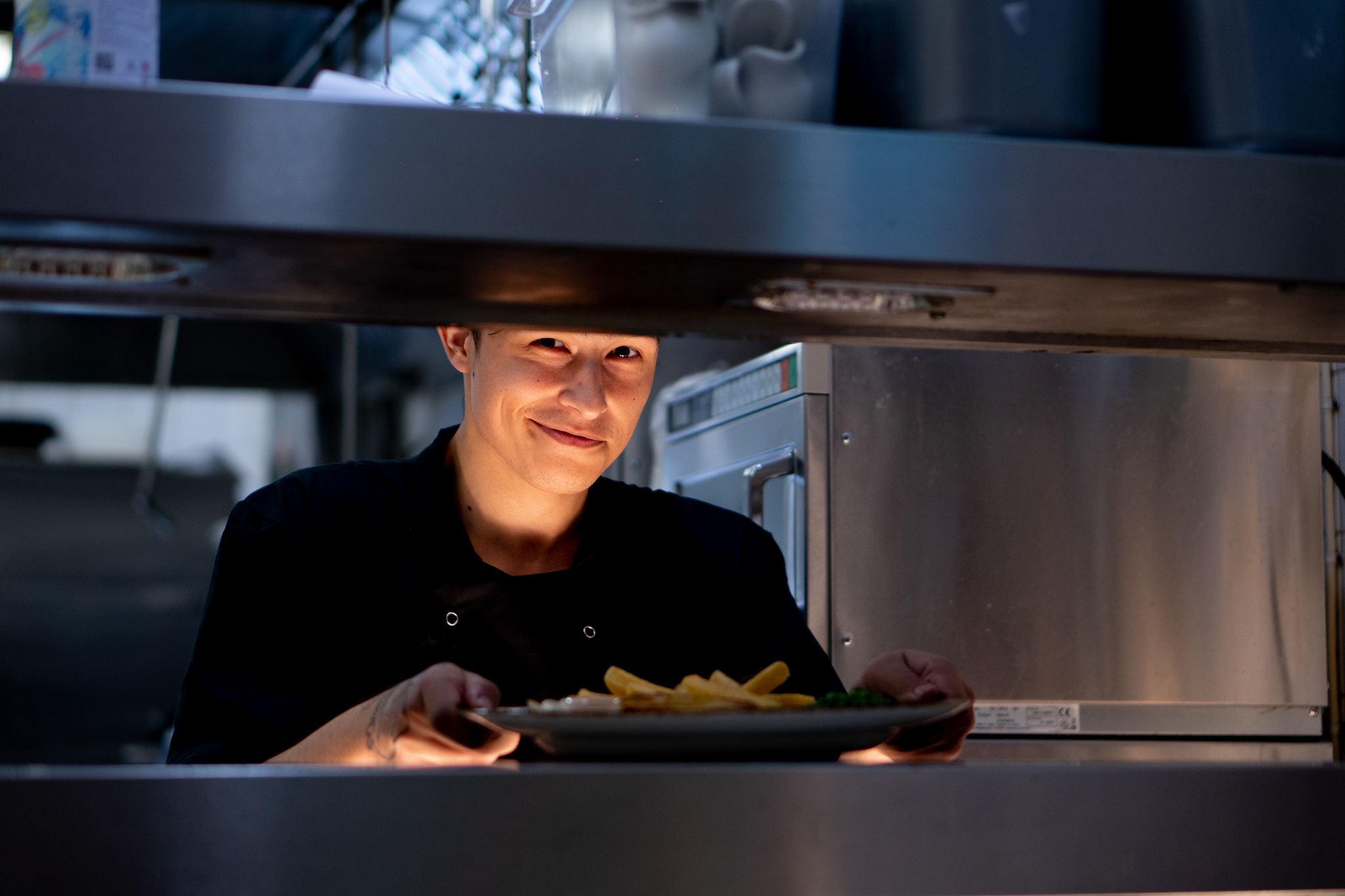 a person holding a plate of food