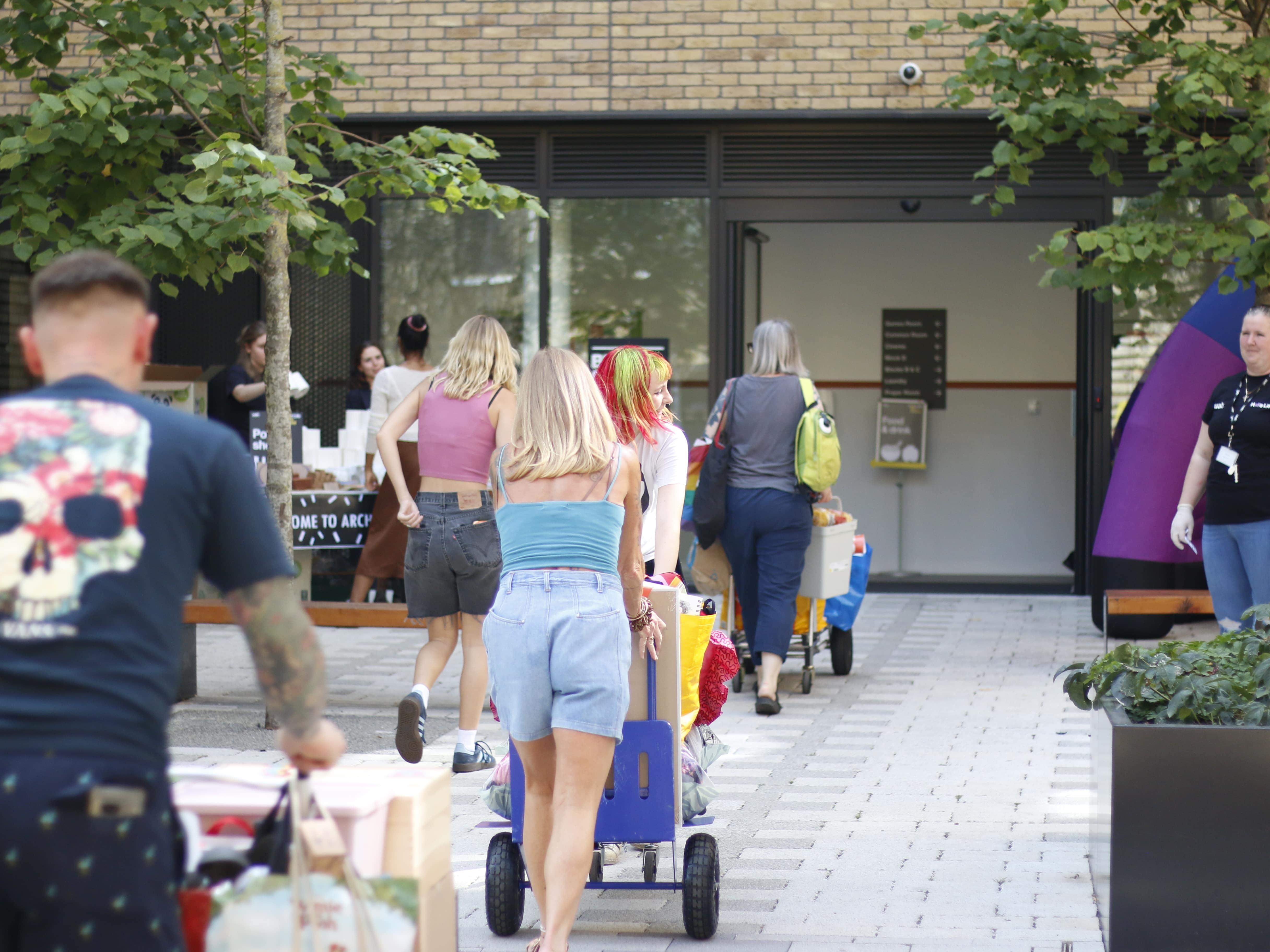 a group of people on a sidewalk