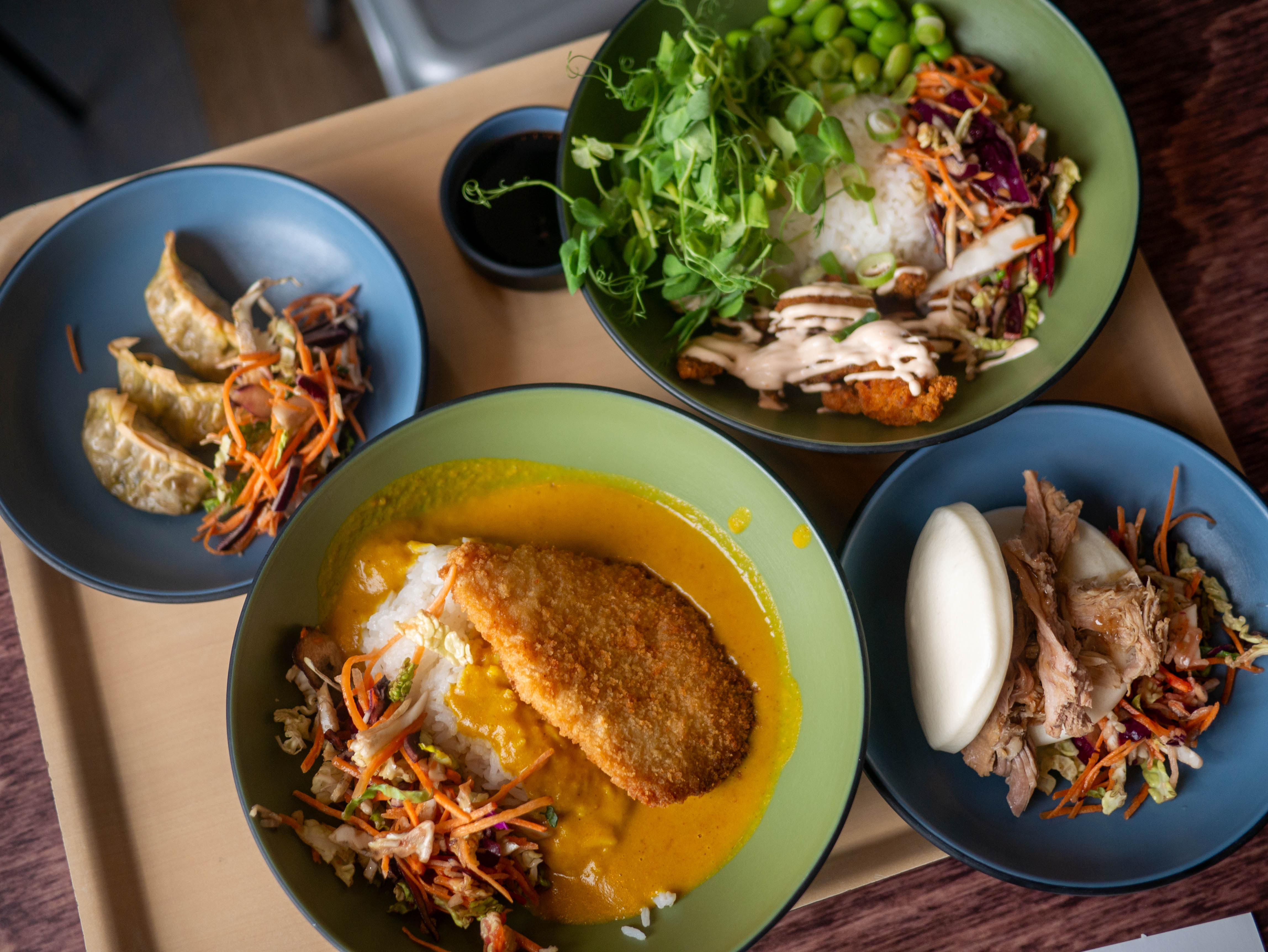 a variety of Asian dishes on a tray