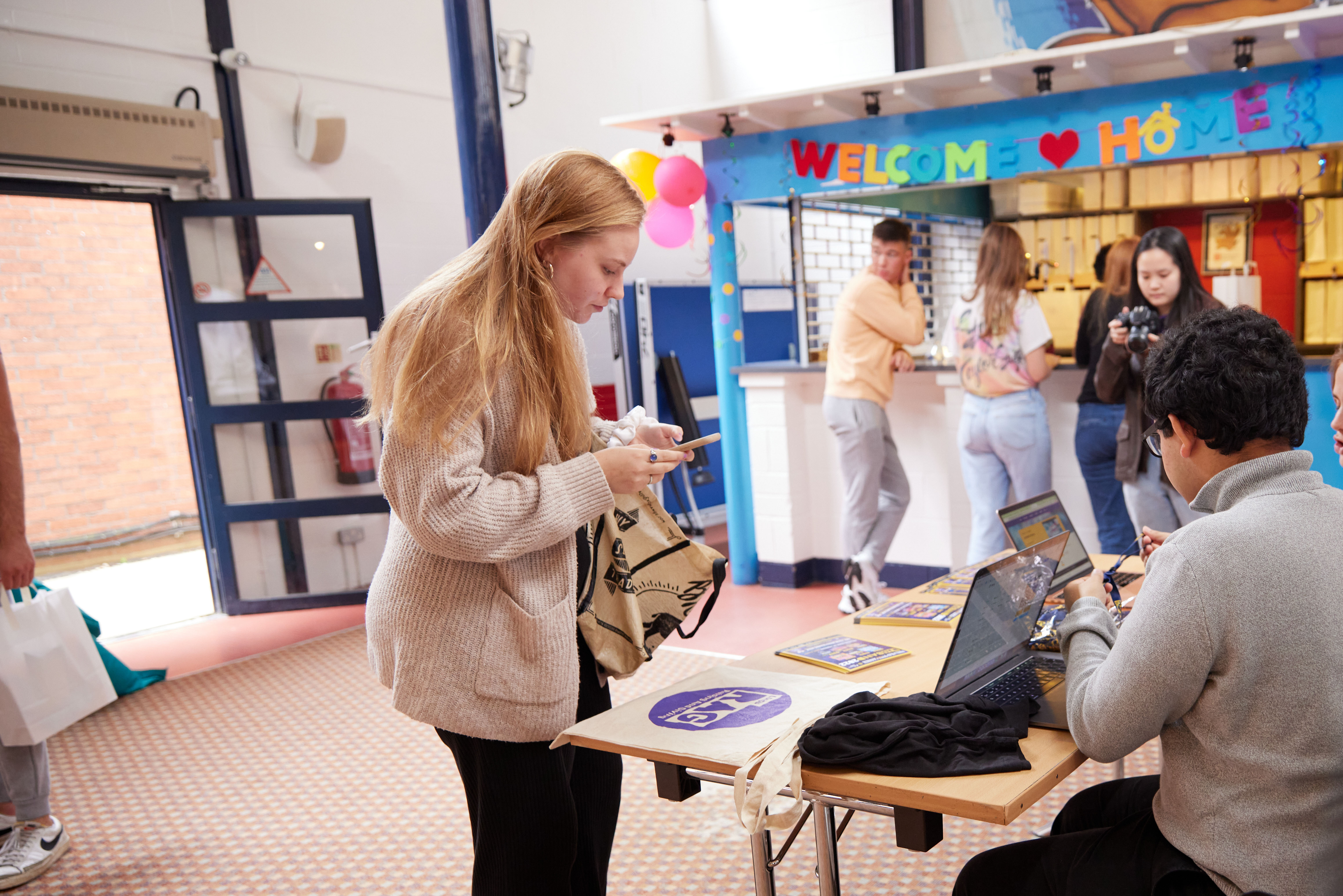 a group of people standing around a table
